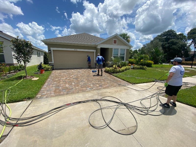 Three exterior cleaners pressure washing stone and concrete cleaning