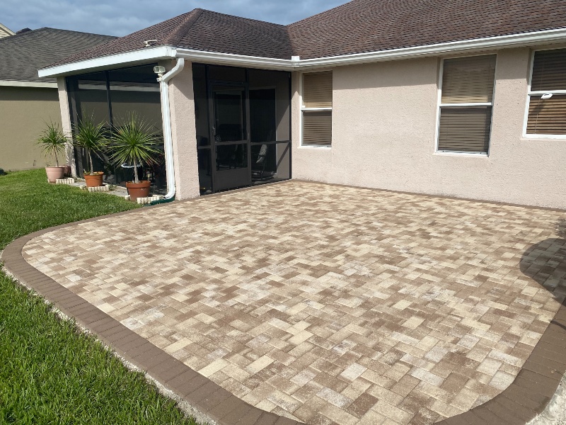 Modern patio with gray paver is clean after pressure washing and paver sealing