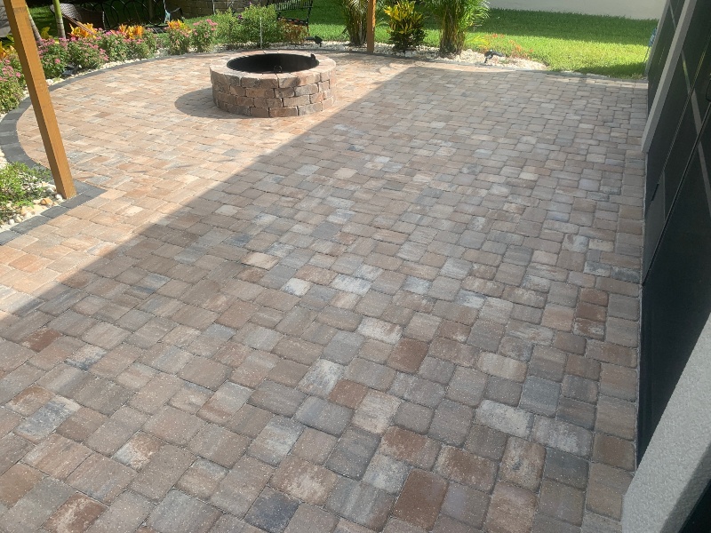 Clean stone and rock patio and fireplace after pressure washing