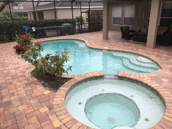 Rustic color poolside and patio looks clean due to paver sealing
