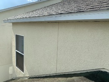 Moldy and unclean roofing and sidewall requires expert pressure washing service