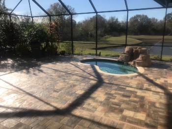 Super shiny pool deck is clean and glossy after paver sealing